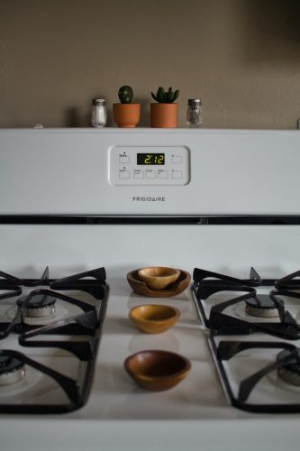 A clean, white stove top
