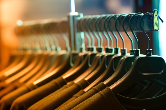 Clothes on hangers in a row