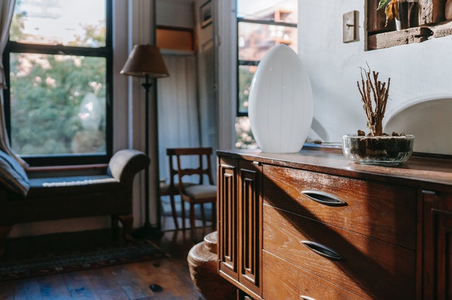 A side view of a living room with daylight coming through