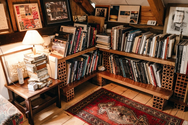 An angled corner in the attic filled with L-shaped shelves