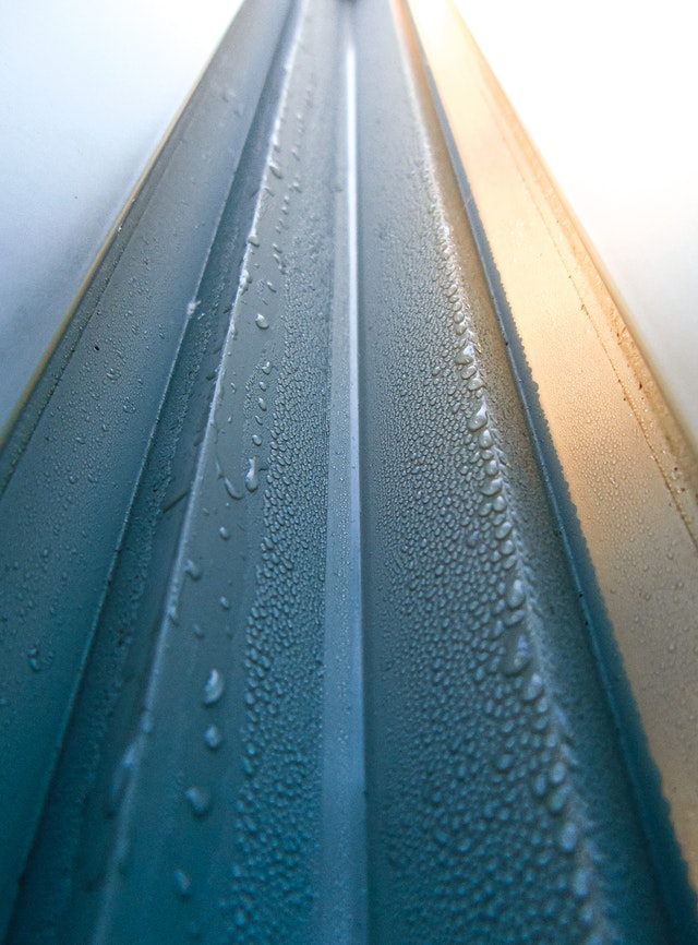 A close up of gutters with water condensation