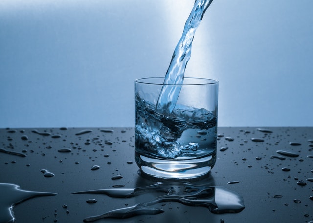 WATER BEING POURED INTO A GLASS