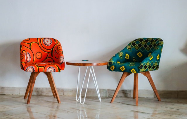 Two bright colored upholstered chairs