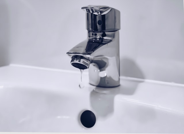 A tap in a bathroom sink.