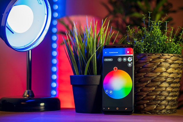 A smart phone showing colors with a light against a block of color. 