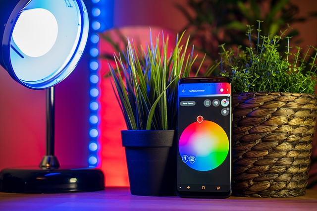 A smart phone showing colors with a light against a block of color.