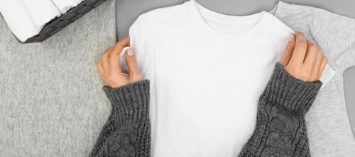 a women folding t-shirts