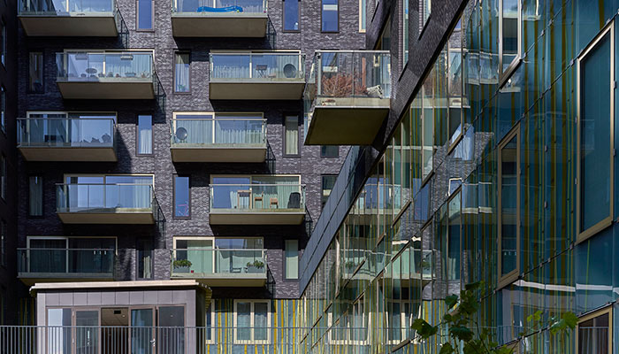 Shot of an apartment building with glass balconies