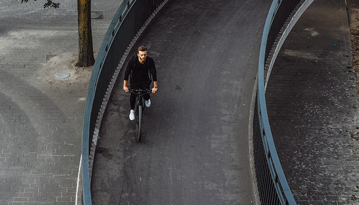 Young sports man on a bicycle