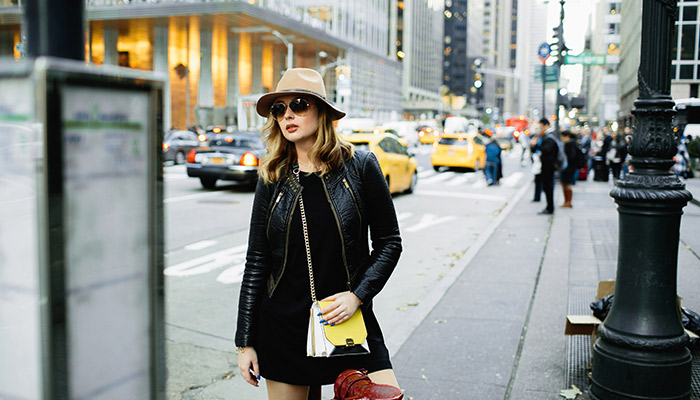 a girl standing on the street of NY