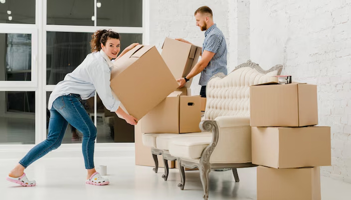 couple packing items for moving
