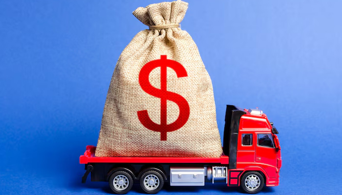 red truck with bag of money