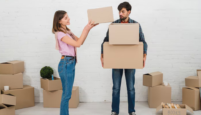 couple packing items for a move
