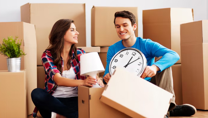 couple packing items for moving