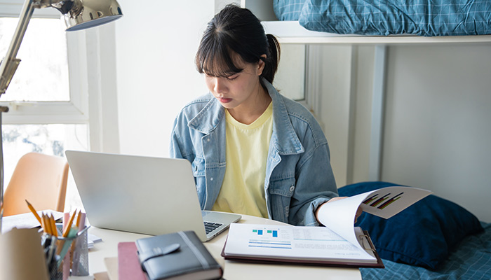 a student in her college dorm room