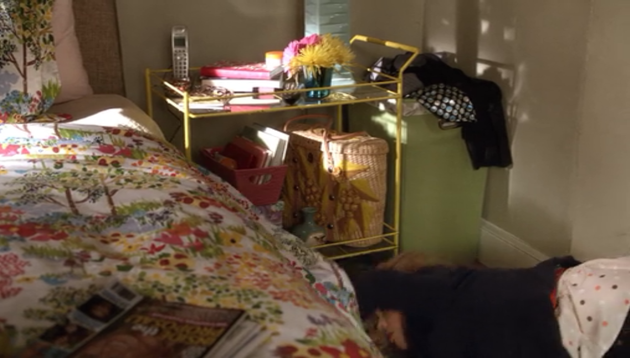 June from Don't Trust the B in Apartment 23 uses a bar cart as a bedside table in her NYC apartment, a convenient storage and organization idea.
