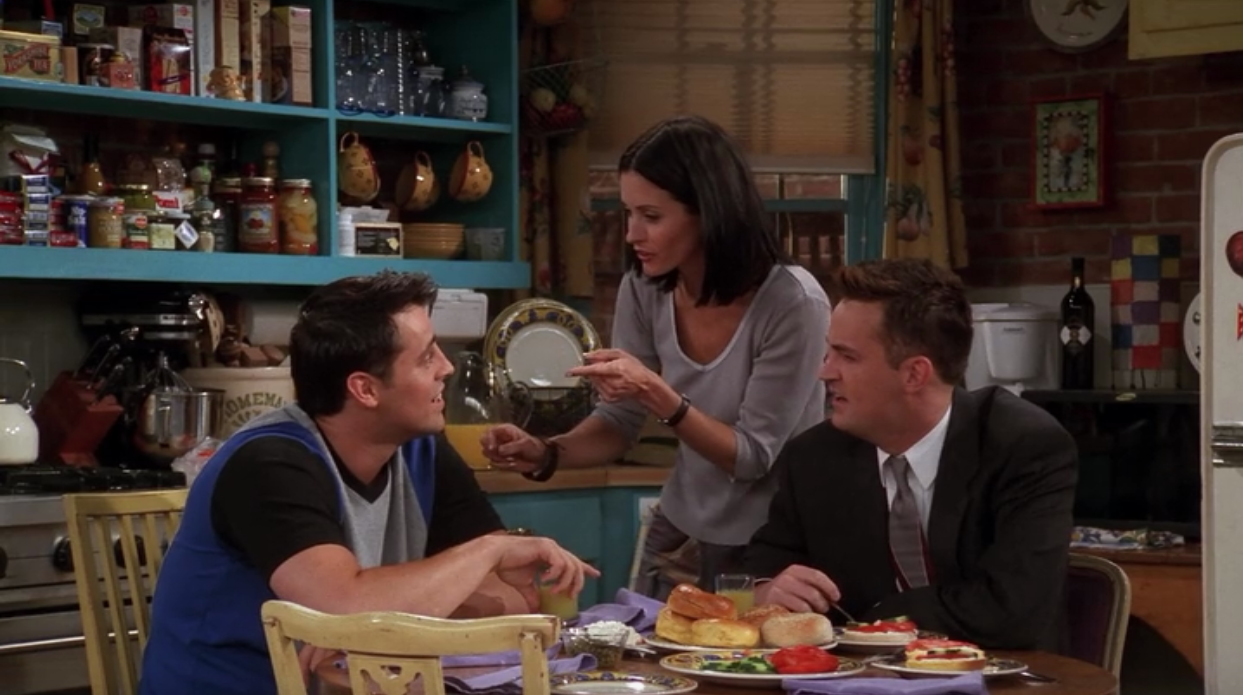 Storing coffee mugs on hooks like Monica from Friends does in her West Village apartment is one of many smart organizing tips and storage ideas.